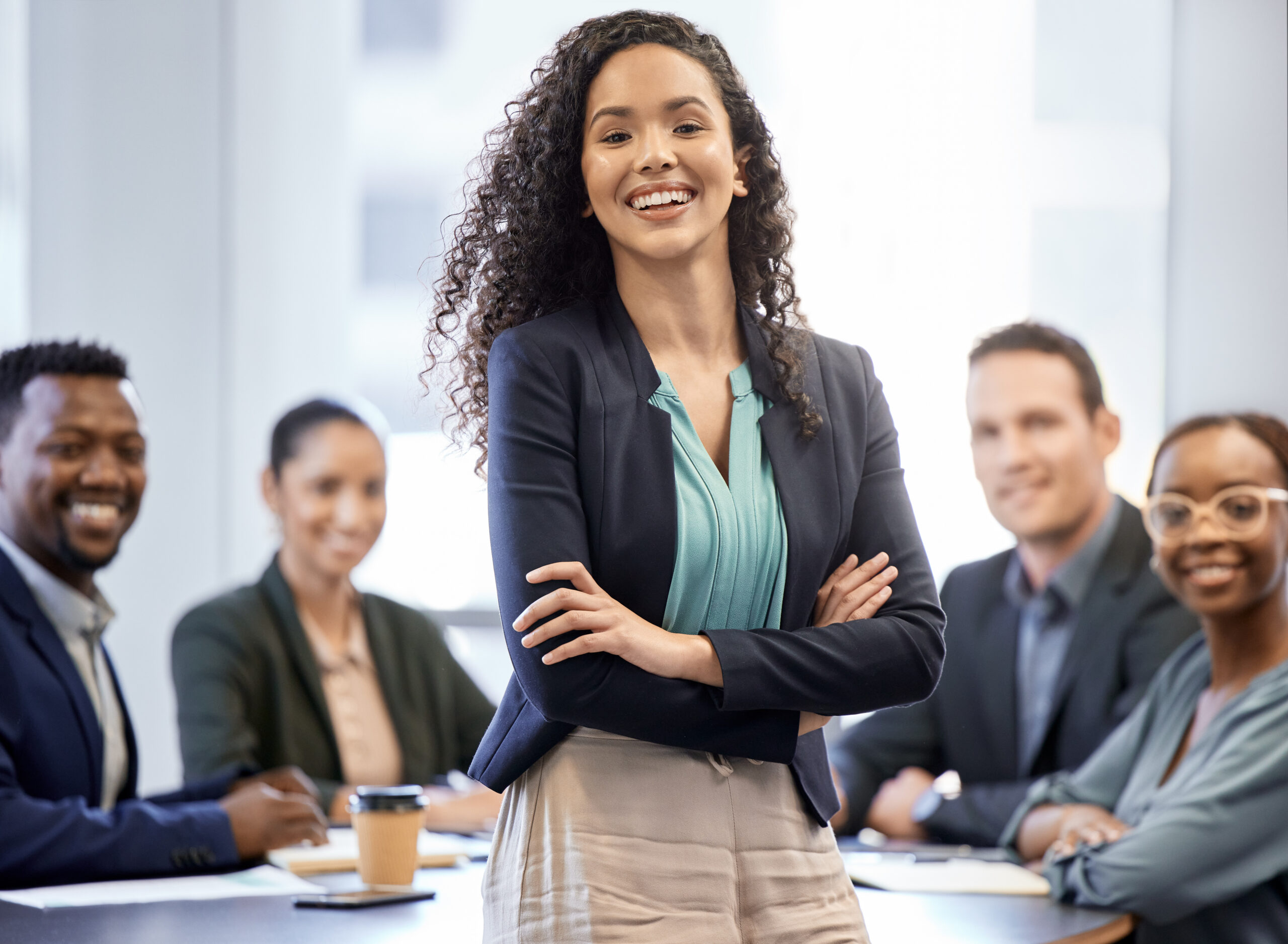 A female professional leading a team meeting, showcasing growth and leadership for beginners.